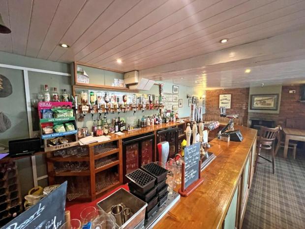 The well stocked bar at The Gold Cup Inn